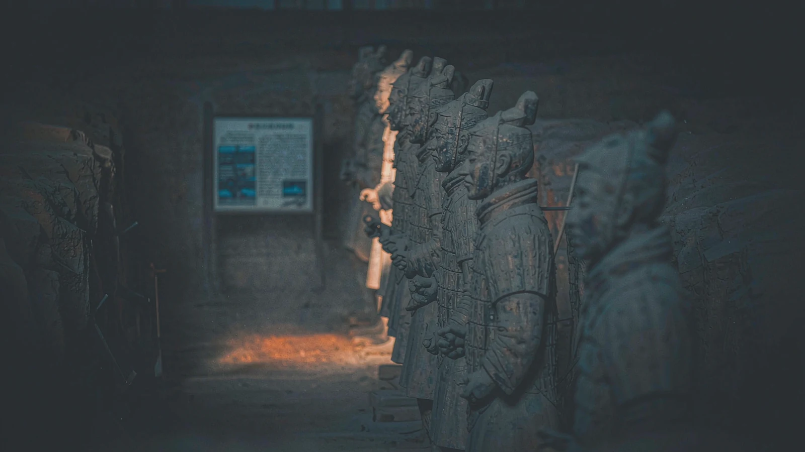 Terracotta warriors in the covered pit, photographed from the side with light coming through the high windows